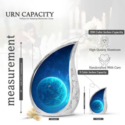 Misty Blue Galaxy Cremation Urn angled view of lid and engraved motif - flowing teardrop galaxy silhouette on curved aluminum - mini keepsake memorial for portion of cremation ashes