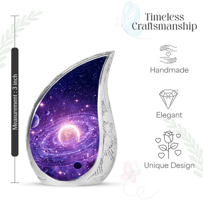Royal Purple Galaxy Cremation Urn angled view of lid and engraved motif - smooth teardrop contour featuring galaxy art - mini keepsake memorial for portion of cremation ashes