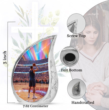 Glossy Black Basketball Cremation Urn angled view of lid and engraved motif - rounded teardrop basketball design with delicate detail - mini keepsake memorial for portion of cremation ashes