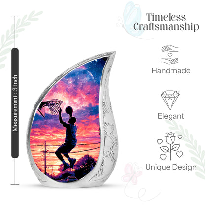 Glossy Black Basketball Cremation Urn angled view of lid and engraved motif - flowing teardrop basketball silhouette on curved aluminum - mini keepsake memorial for portion of cremation ashes