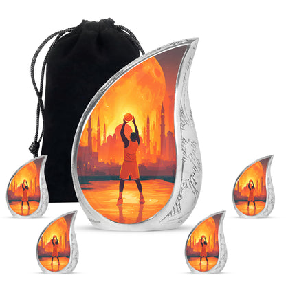 Wine Red Basketball Cremation Urn side profile showing urn shape - rounded teardrop basketball design with delicate detail - memorial set with one large and four small urns