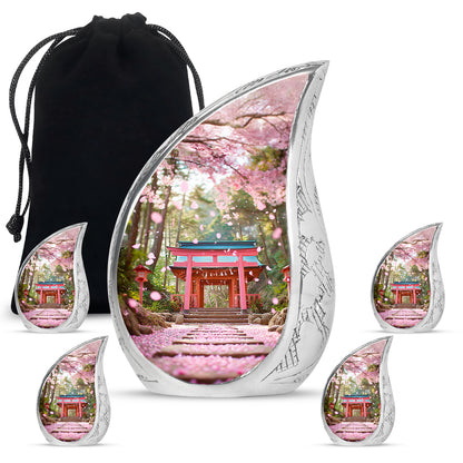 Royal Gold Cherry Blossom Cremation Urn side profile showing urn shape - graceful tear-shaped urn with cherry blossom motif - memorial set with one large and four small urns