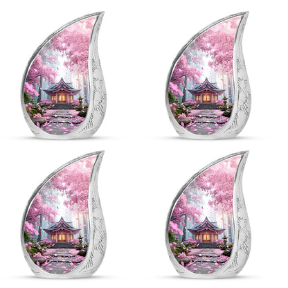Dusty Pink Cherry Blossom Cremation Urn close-up of engraving and surface detail - smooth teardrop contour featuring cherry blossom art - 10 inch aluminum urn for cremated remains