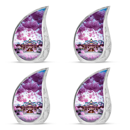 Vintage Pink Cherry Blossom Cremation Urn close-up of engraving and surface detail - smooth teardrop contour featuring cherry blossom art - 10 inch aluminum urn for cremated remains