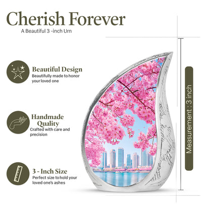 Azure Cherry Blossom Cremation Urn angled view of lid and engraved motif - rounded teardrop cherry blossom design with delicate detail - mini keepsake memorial for portion of cremation ashes