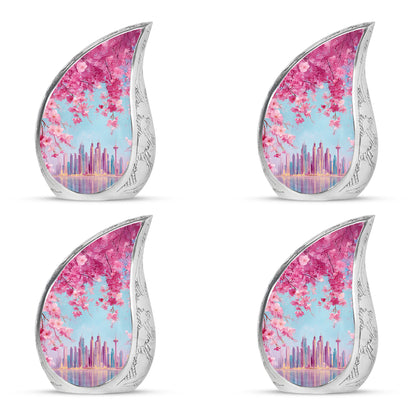 Bright Blue Cherry Blossom Cremation Urn close-up of engraving and surface detail - graceful tear-shaped urn with cherry blossom motif - 10 inch aluminum urn for cremated remains