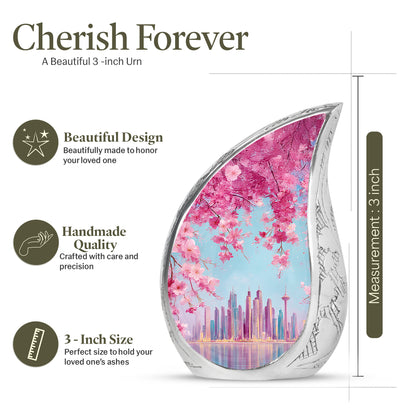 Cornflower Blue Cherry Blossom Cremation Urn angled view of lid and engraved motif - graceful tear-shaped urn with cherry blossom motif - mini keepsake memorial for portion of cremation ashes