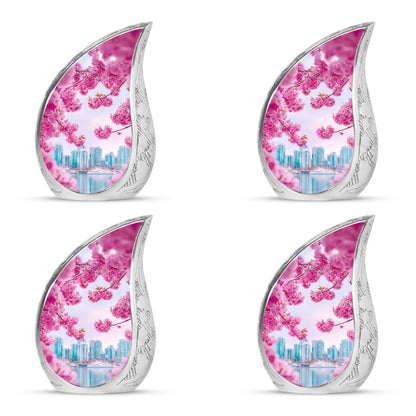 Soft Pink Cherry Blossom Cremation Urn close-up of engraving and surface detail - smooth teardrop contour featuring cherry blossom art - 10 inch aluminum urn for cremated remains