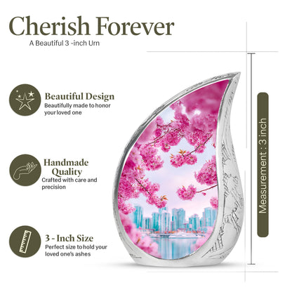 Coral Pink Cherry Blossom Cremation Urn angled view of lid and engraved motif - rounded teardrop cherry blossom design with delicate detail - mini keepsake memorial for portion of cremation ashes