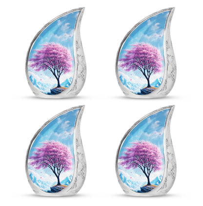 Sapphire Blue Cherry Blossom Cremation Urn close-up of engraving and surface detail - smooth teardrop contour featuring cherry blossom art - 10 inch aluminum urn for cremated remains