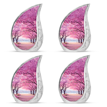 Coral Pink Cherry Blossom Cremation Urn close-up of engraving and surface detail - flowing teardrop cherry blossom silhouette on curved aluminum - 10 inch aluminum urn for cremated remains