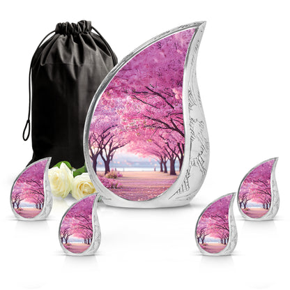 Pastel Pink Cherry Blossom Cremation Urn side profile showing urn shape - flowing teardrop cherry blossom silhouette on curved aluminum - memorial set with one large and four small urns
