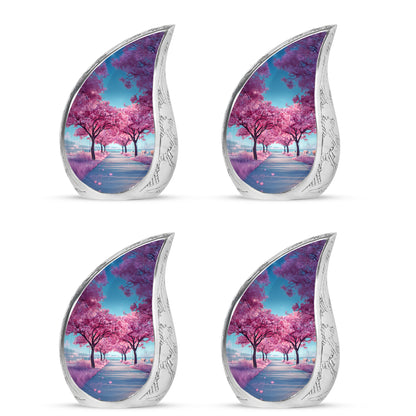 Sky Blue Cherry Blossom Cremation Urn close-up of engraving and surface detail - rounded teardrop cherry blossom design with delicate detail - 10 inch aluminum urn for cremated remains