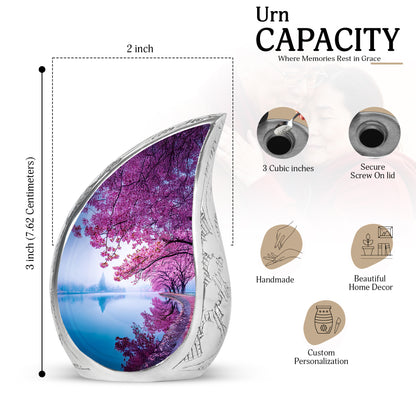Dusty Blue Cherry Blossom Cremation Urn angled view of lid and engraved motif - rounded teardrop cherry blossom design with delicate detail - mini keepsake memorial for portion of cremation ashes