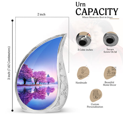Cloud White Cherry Blossom Cremation Urn angled view of lid and engraved motif - smooth teardrop contour featuring cherry blossom art - mini keepsake memorial for portion of cremation ashes