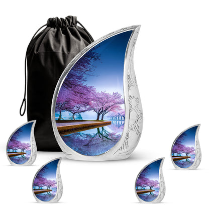 Navy Blue Cherry Blossom Cremation Urn side profile showing urn shape - rounded teardrop cherry blossom design with delicate detail - memorial set with one large and four small urns