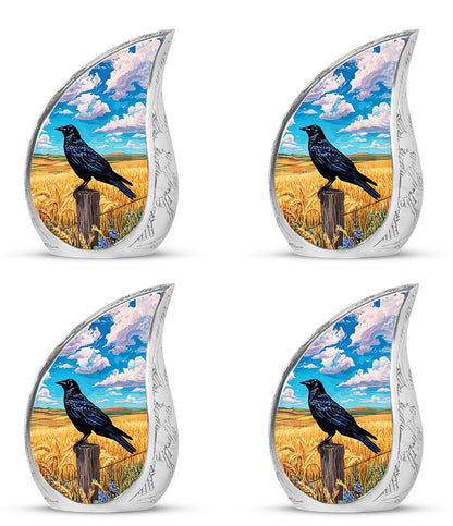 Sky Blue Crow Cremation Urn close-up of engraving and surface detail - rounded teardrop crow design with delicate detail - 10 inch aluminum urn for cremated remains