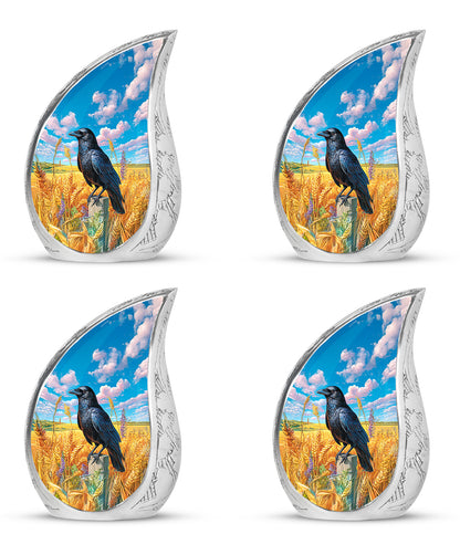 Pastel Blue Crow Cremation Urn close-up of engraving and surface detail - rounded teardrop crow design with delicate detail - 10 inch aluminum urn for cremated remains