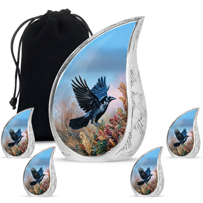 Soft Blue Crow Cremation Urn side profile showing urn shape - graceful tear-shaped urn with crow motif - memorial set with one large and four small urns