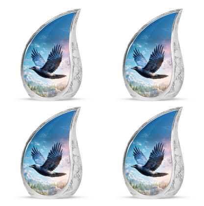 Celestial Blue Crow Cremation Urn close-up of engraving and surface detail - flowing teardrop crow silhouette on curved aluminum - 10 inch aluminum urn for cremated remains
