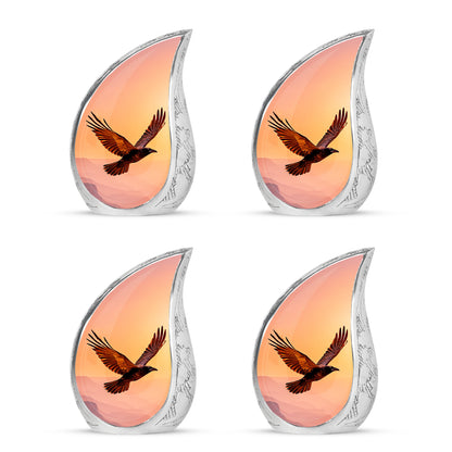 Wine Red Crow Cremation Urn close-up of engraving and surface detail - rounded teardrop crow design with delicate detail - 10 inch aluminum urn for cremated remains