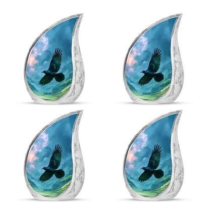 Powder Blue Crow Cremation Urn close-up of engraving and surface detail - rounded teardrop crow design with delicate detail - 10 inch aluminum urn for cremated remains