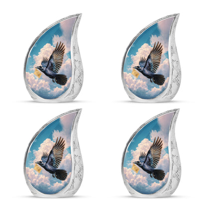 Slate Blue Crow Cremation Urn close-up of engraving and surface detail - flowing teardrop crow silhouette on curved aluminum - 10 inch aluminum urn for cremated remains