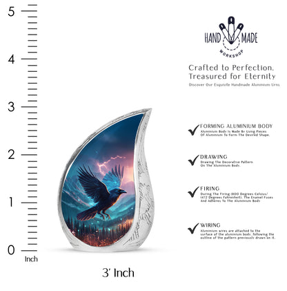 Celestial Blue Crow Cremation Urn angled view of lid and engraved motif - rounded teardrop crow design with delicate detail - mini keepsake memorial for portion of cremation ashes