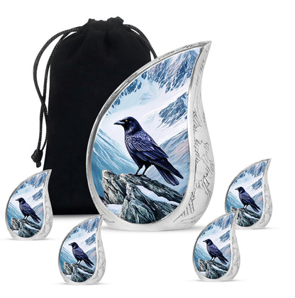 Icy Blue Crow Cremation Urn side profile showing urn shape - rounded teardrop crow design with delicate detail - memorial set with one large and four small urns