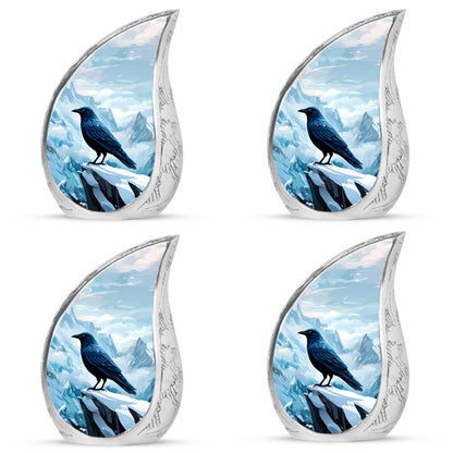 Serene Blue Crow Cremation Urn close-up of engraving and surface detail - smooth teardrop contour featuring crow art - 10 inch aluminum urn for cremated remains