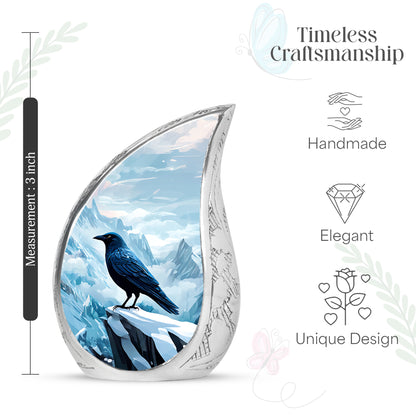 Royal Blue Crow Cremation Urn angled view of lid and engraved motif - smooth teardrop contour featuring crow art - mini keepsake memorial for portion of cremation ashes