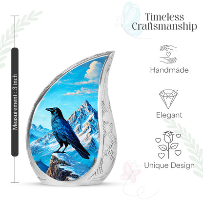 Calming Blue Crow Cremation Urn angled view of lid and engraved motif - graceful tear-shaped urn with crow motif - mini keepsake memorial for portion of cremation ashes