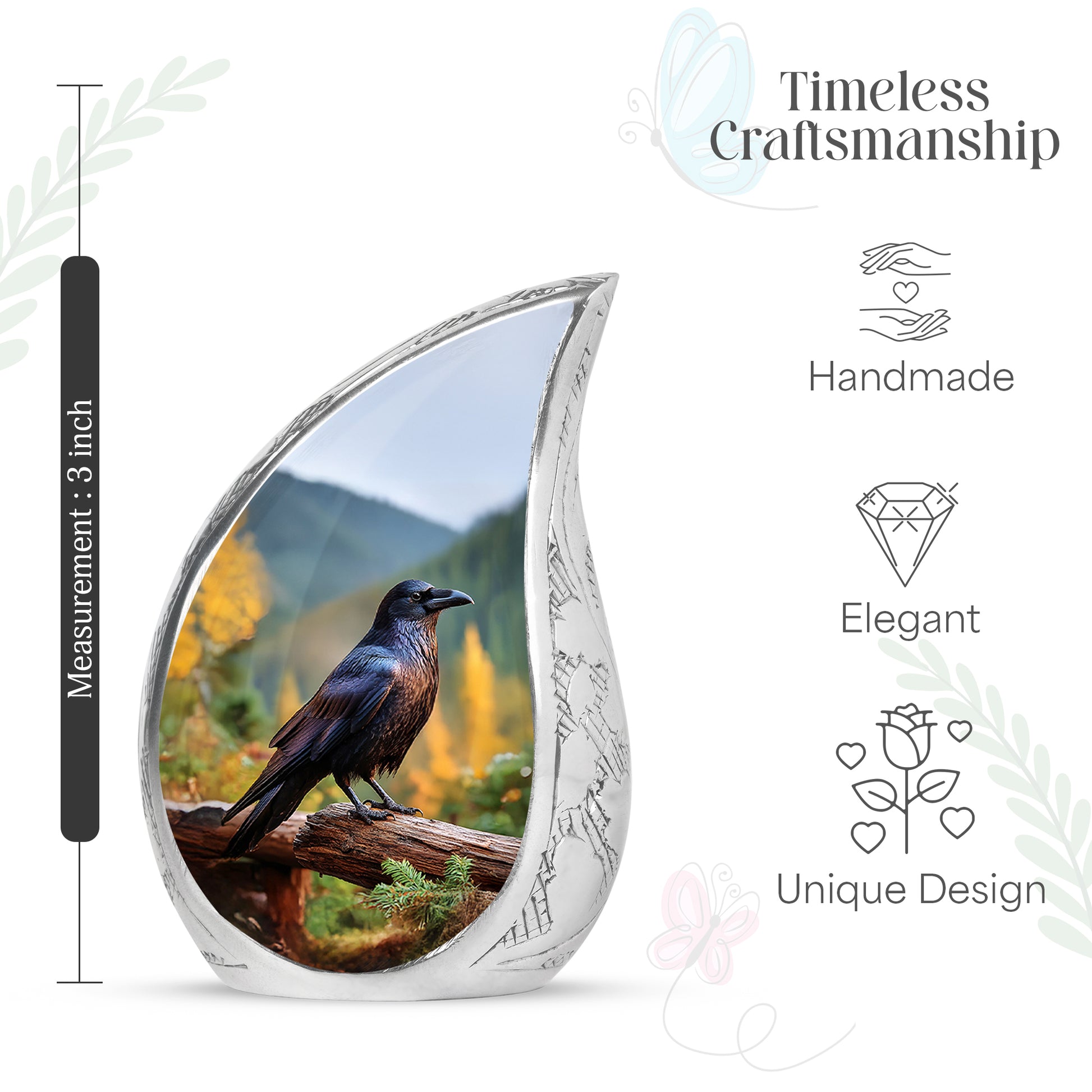 Soft Blue Crow Cremation Urn angled view of lid and engraved motif - graceful tear-shaped urn with crow motif - mini keepsake memorial for portion of cremation ashes