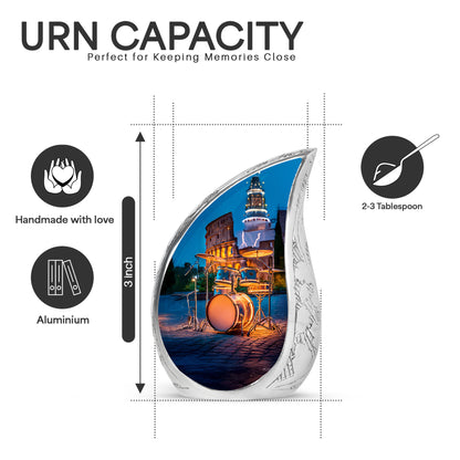 Sky Blue Drums Cremation Urn angled view of lid and engraved motif - flowing teardrop drums silhouette on curved aluminum - mini keepsake memorial for portion of cremation ashes