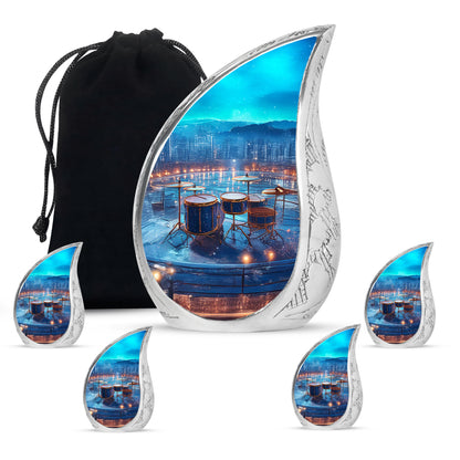 Cobalt Blue Drums Cremation Urn side profile showing urn shape - smooth teardrop contour featuring drums art - memorial set with one large and four small urns