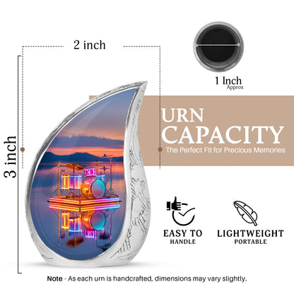Blush Pink Drums Cremation Urn angled view of lid and engraved motif - flowing teardrop drums silhouette on curved aluminum - mini keepsake memorial for portion of cremation ashes