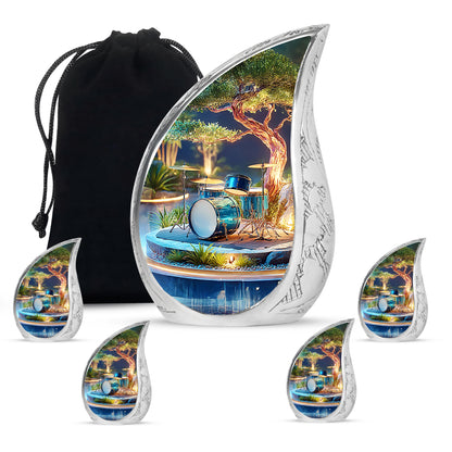 Sunrise Gold Drums Cremation Urn side profile showing urn shape - flowing teardrop drums silhouette on curved aluminum - memorial set with one large and four small urns