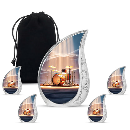 Celestial Blue Drums Cremation Urn side profile showing urn shape - flowing teardrop drums silhouette on curved aluminum - memorial set with one large and four small urns