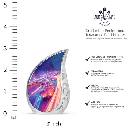 Sky Blue Drums Cremation Urn angled view of lid and engraved motif - flowing teardrop drums silhouette on curved aluminum - mini keepsake memorial for portion of cremation ashes