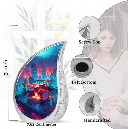 Pastel Blue Drums Cremation Urn angled view of lid and engraved motif - flowing teardrop drums silhouette on curved aluminum - mini keepsake memorial for portion of cremation ashes