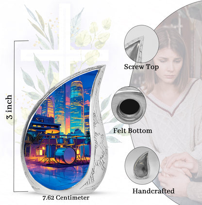 Sapphire Blue Drums Cremation Urn angled view of lid and engraved motif - graceful tear-shaped urn with drums motif - mini keepsake memorial for portion of cremation ashes