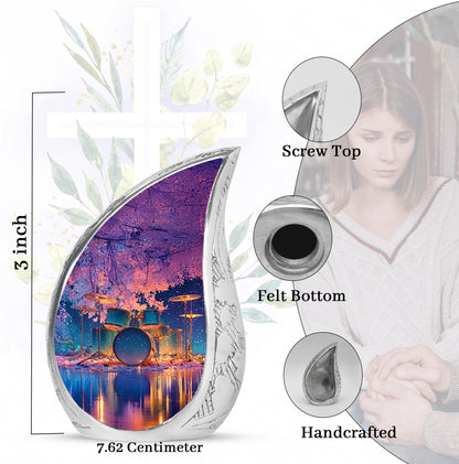 Sapphire Blue Drums Cremation Urn angled view of lid and engraved motif - graceful tear-shaped urn with drums motif - mini keepsake memorial for portion of cremation ashes
