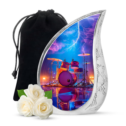 Dusty Blue Drums Cremation Urn front view showing detailed design - flowing teardrop drums silhouette on curved aluminum - full-size 10 inch 200 cubic inch adult cremation urn