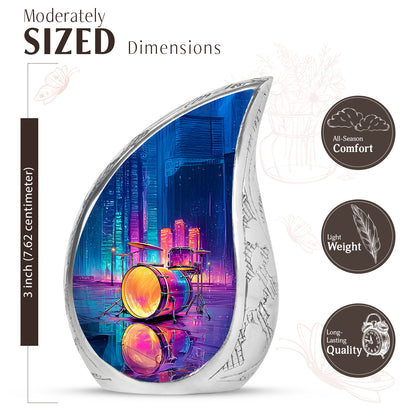 Slate Blue Drums Cremation Urn angled view of lid and engraved motif - flowing teardrop drums silhouette on curved aluminum - mini keepsake memorial for portion of cremation ashes