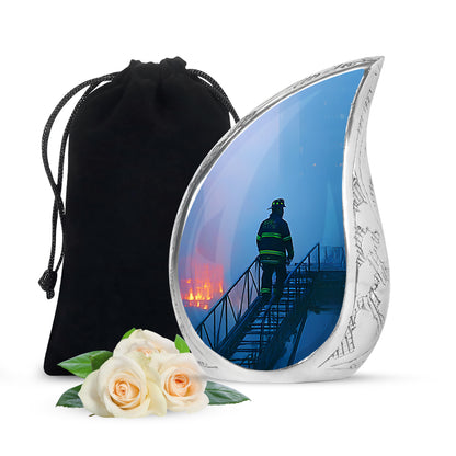 Sky Blue Firefighter Cremation Urn front view showing detailed design - flowing teardrop firefighter silhouette on curved aluminum - full-size 10 inch 200 cubic inch adult cremation urn