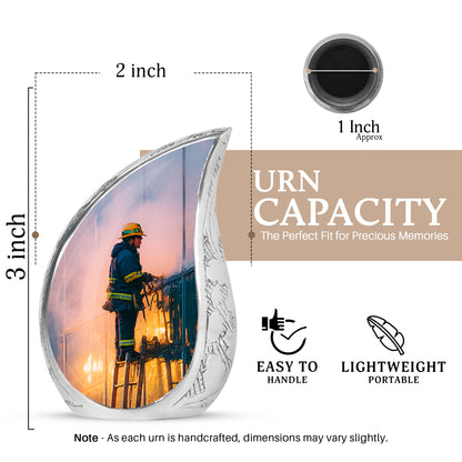 Celestial Blue Firefighter Cremation Urn angled view of lid and engraved motif - flowing teardrop firefighter silhouette on curved aluminum - mini keepsake memorial for portion of cremation ashes
