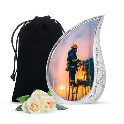 Indigo Firefighter Cremation Urn front view showing detailed design - flowing teardrop firefighter silhouette on curved aluminum - full-size 10 inch 200 cubic inch adult cremation urn