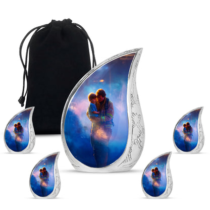 Indigo Firefighter Cremation Urn side profile showing urn shape - flowing teardrop firefighter silhouette on curved aluminum - memorial set with one large and four small urns