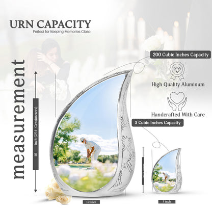 Platinum Silver Golf Cremation Urn angled view of lid and engraved motif - rounded teardrop golf design with delicate detail - mini keepsake memorial for portion of cremation ashes