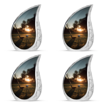 Gilded Gold Golf Cremation Urn close-up of engraving and surface detail - flowing teardrop golf silhouette on curved aluminum - 10 inch aluminum urn for cremated remains